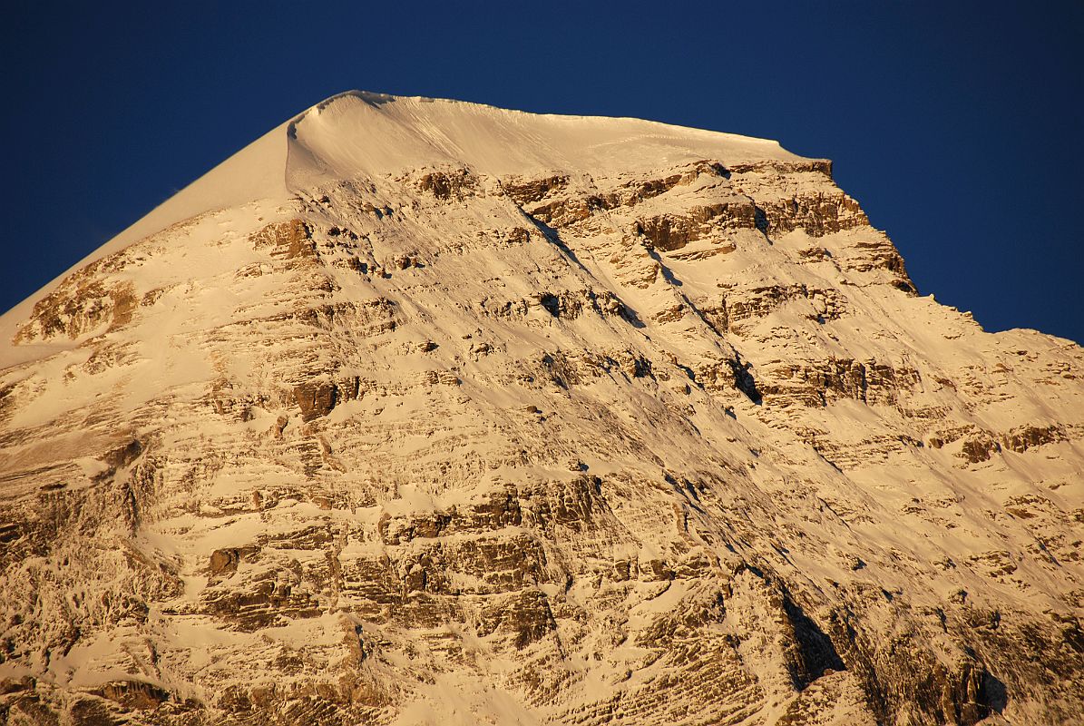 18 Tsha Tung Summit Close Up At Sunrise From Drakpochen Tsha Tung (5995m) summit area glows at sunrise from Drakpochen. Tsha Tung was climbed for the first time by Jo Cleere and Victor Saunders on June 19, 2005 via the East Ridge.